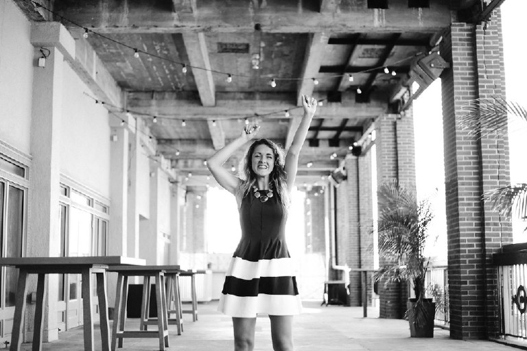 Kaitlyn smiling at Asbury Park for unique Jersey Shore Senior Photos by Kasey Ivan Photography