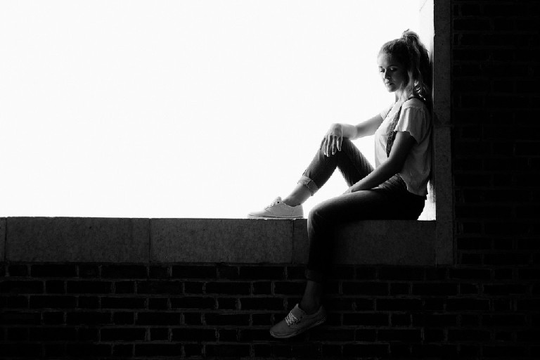 looking out over asbury park for unique fun senior photo idea by Kasey Ivan Photography