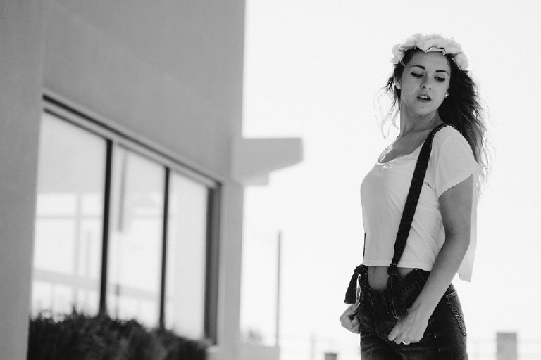 flower crown and overalls senior pictures pose on jersey shore by Kasey Ivan Photography