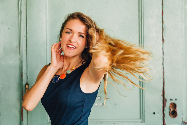 hair flip pose for unique senior photo idea by Kasey Ivan Photography