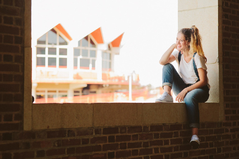 looking out over asbury park for unique fun senior photo idea by Kasey Ivan Photography