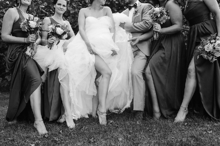 bride and bridesmaid leg photo black and white at Chimney Hill Estate wedding in Lambertville NJ