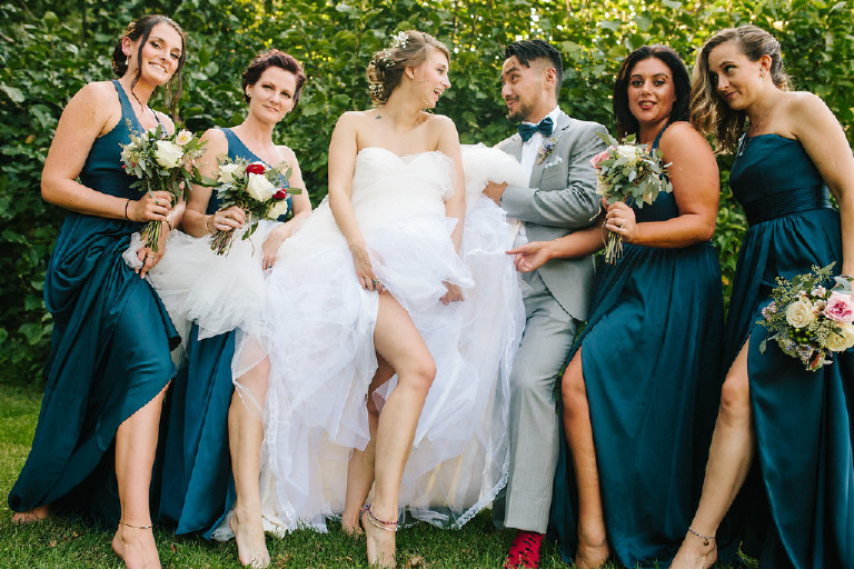 bridesmaids laughing with bridesman at Chimney Hill Estate wedding in Lambertville NJ