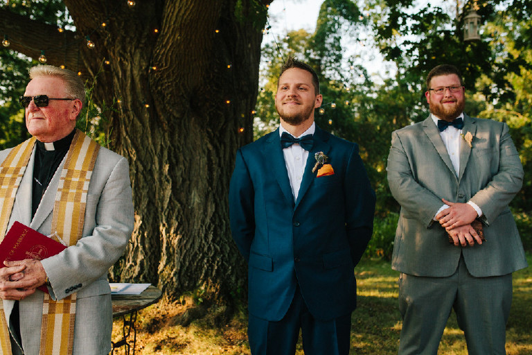 groom smiles when first sees bride at Chimney Hill Estate wedding ceremony in Lambertville NJ