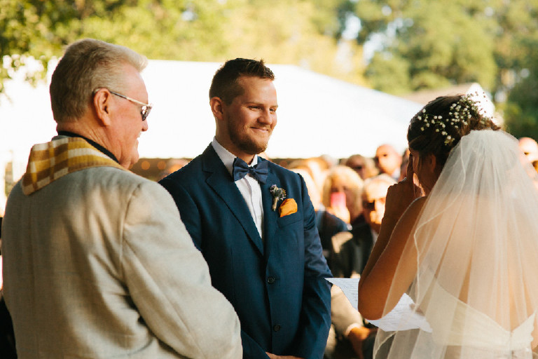 groom smiling at bride during Chimney Hill Estate wedding ceremony in Lambertville NJ by Kasey Ivan Photography