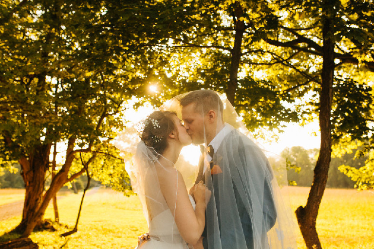 dreamy sunset kiss by bride and groom at Chimney Hill Estate wedding in Lambertville by Kasey Ivan Photography