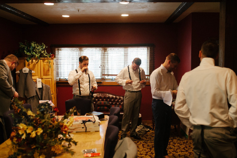 groomsmen getting dressed at Chimney Hill Estate wedding in Lambertville