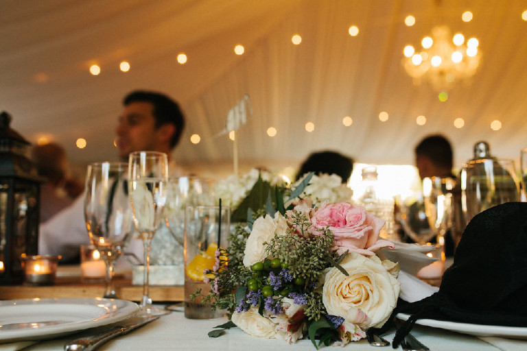 bouquet on long table at rustic Chimney Hill Estate wedding reception in Lambertville by Kasey Ivan Photography