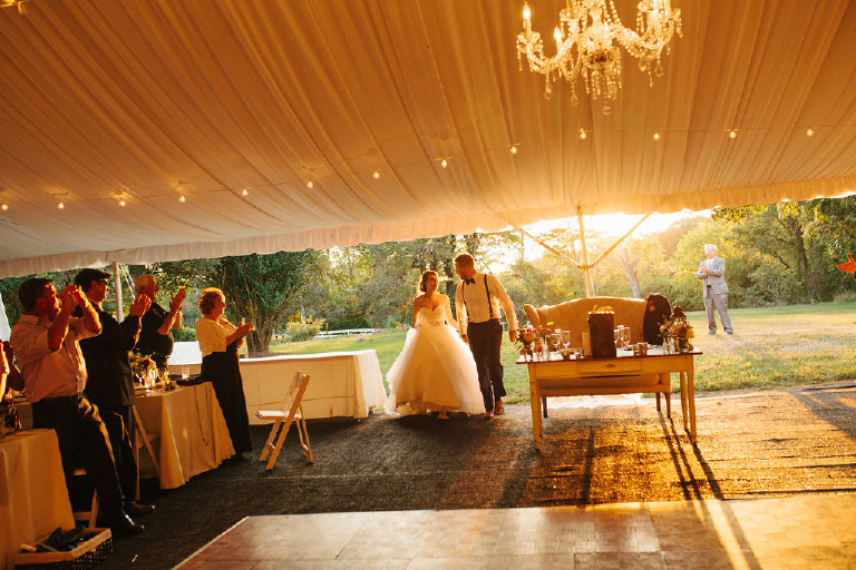 bride and groom enter under canopy at Chimney Hill Estate wedding reception in Lambertville by Kasey Ivan Photography