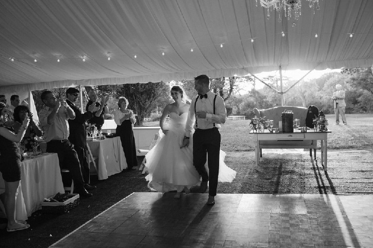 black and white entrance of the bride and groom to the party at Chimney Hill Estate wedding reception in Lambertville by Kasey Ivan Photography