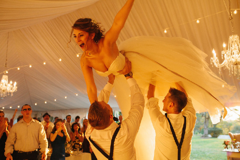 bride flies in the air at Chimney Hill Estate wedding reception in Lambertville by Kasey Ivan Photography
