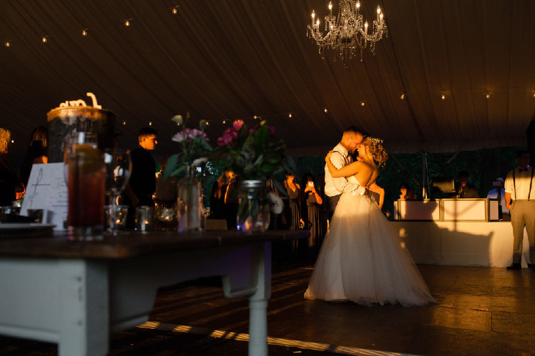 first dance under canopy tent during sunset at Chimney Hill Estate wedding reception by Kasey Ivan Photography