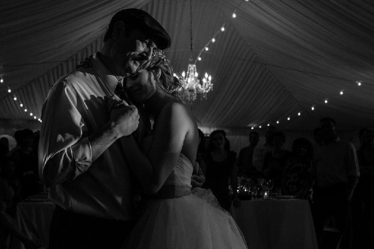 father daughter dance under canopy tent during sunset at Chimney Hill Estate wedding reception by Kasey Ivan Photography