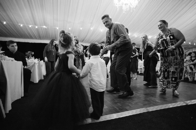 guests dance under canopy tent at Chimney Hill Estate wedding reception by Kasey Ivan Photography