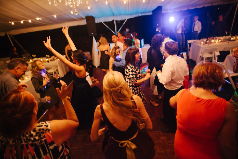 guests dance and party under canopy tent at Chimney Hill Estate wedding reception by Kasey Ivan Photography