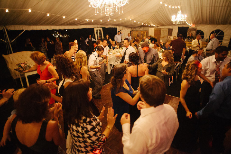 guests dance under canopy tent at Chimney Hill Estate wedding reception by Kasey Ivan Photography