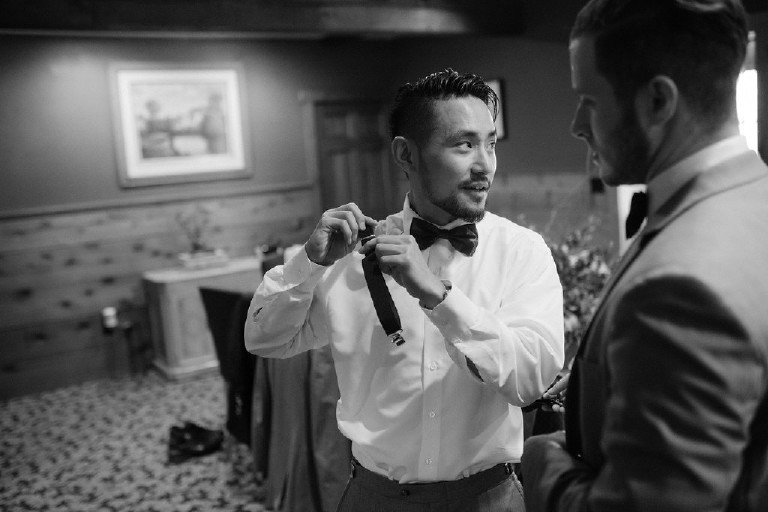 groomsman getting ready at Chimney Hill Estate wedding in Lambertville