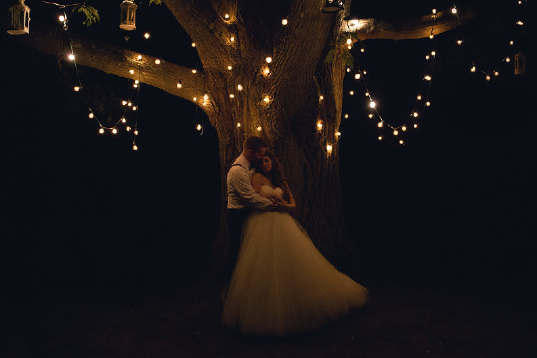 under a canopy of lights at twilight at Chimney Hill Estate by Kasey Ivan Photography