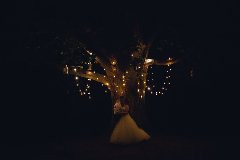 romantic night image of lantern lights in tree at Chimney Hill Estate wedding reception by Kasey Ivan Photography