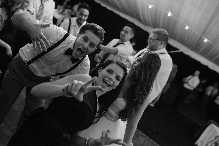 guests dance under canopy tent at Chimney Hill Estate wedding reception by Kasey Ivan Photography
