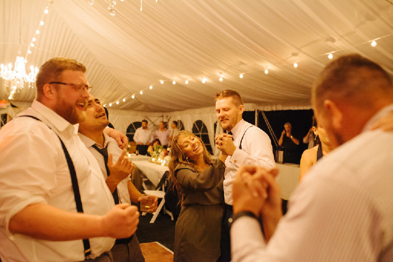 guests dance under canopy tent at Chimney Hill Estate wedding reception by Kasey Ivan Photography