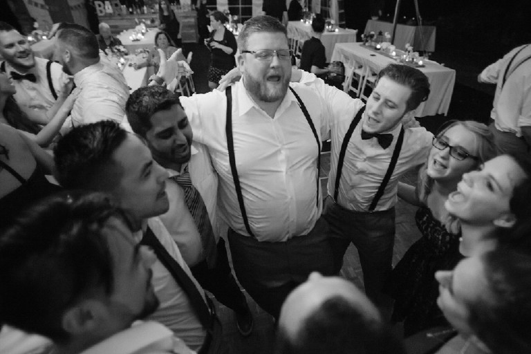 guests dance under canopy tent at Chimney Hill Estate wedding reception by Kasey Ivan Photography