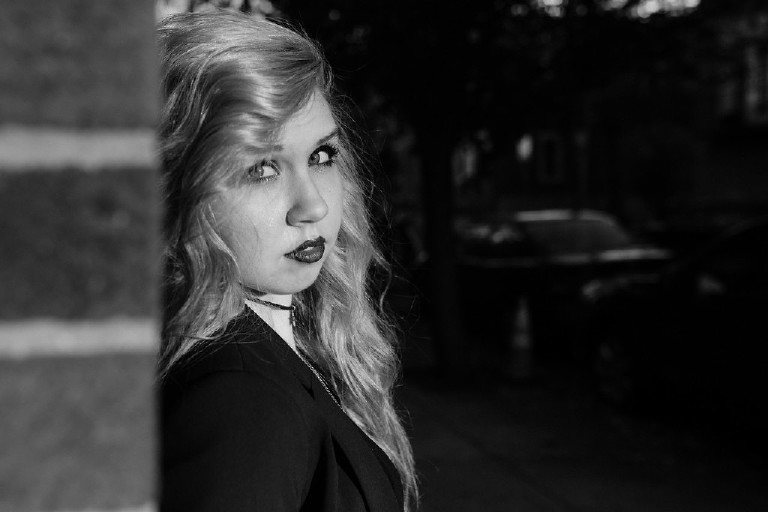 moody black and white emotive girl in downtown Philadelphia for senior photos by Kasey Ivan Photography
