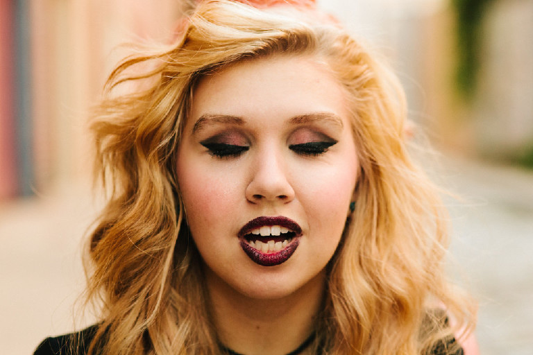 artistic beautiful mouth and teeth girl in downtown Philadelphia for senior photos by Kasey Ivan Photography