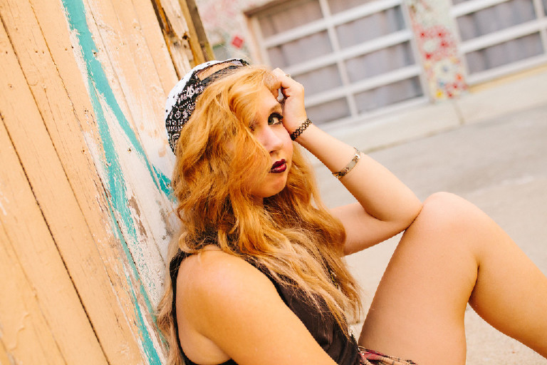 posing outside Magic Garden South Street in Philadephia for senior photos by Kasey Ivan Photography