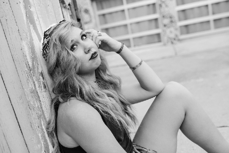 posing outside Magic Garden South Street in Philadephia for senior photos by Kasey Ivan Photography