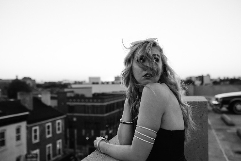 windy rooftop senior photos in downtown south street philadelphia by Kasey Ivan Photography