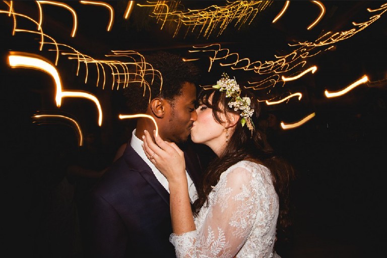 unique beautiful light trails long exposure flash shot during reception dance kiss by Kasey Ivan Photography from New Hope