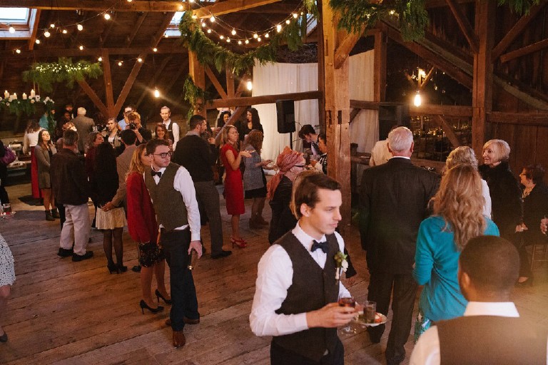 guests talk at rustic african barn wedding at Windy Hollow Farm in the poconos