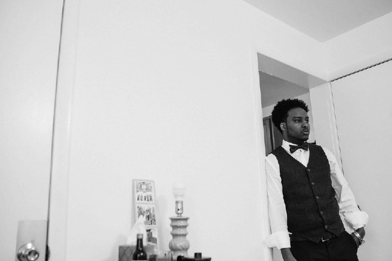 groomsman before rustic ethiopian barn wedding in the poconos