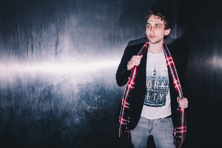 JD in front of metallic background for fashion editorial in center city Philadelphia by Kasey Ivan Photography