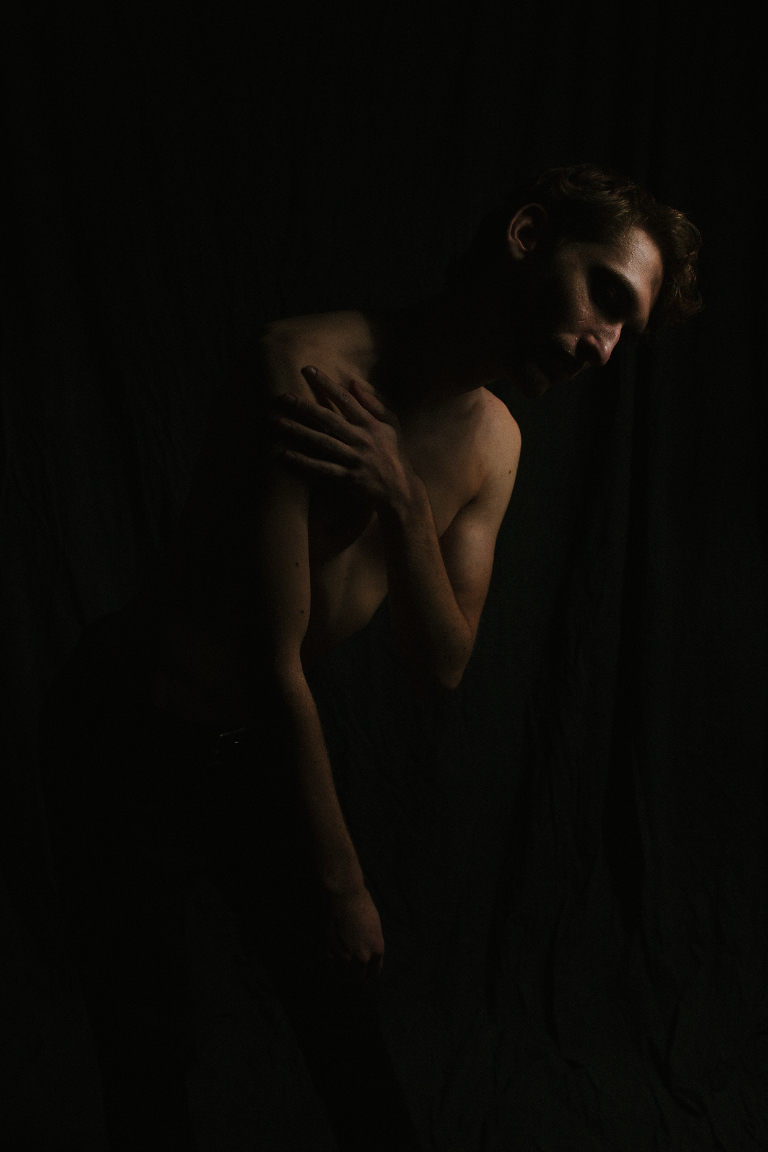 shirtless male model in dramatic light by New Hope and Lambertville photographer Kasey Ivan