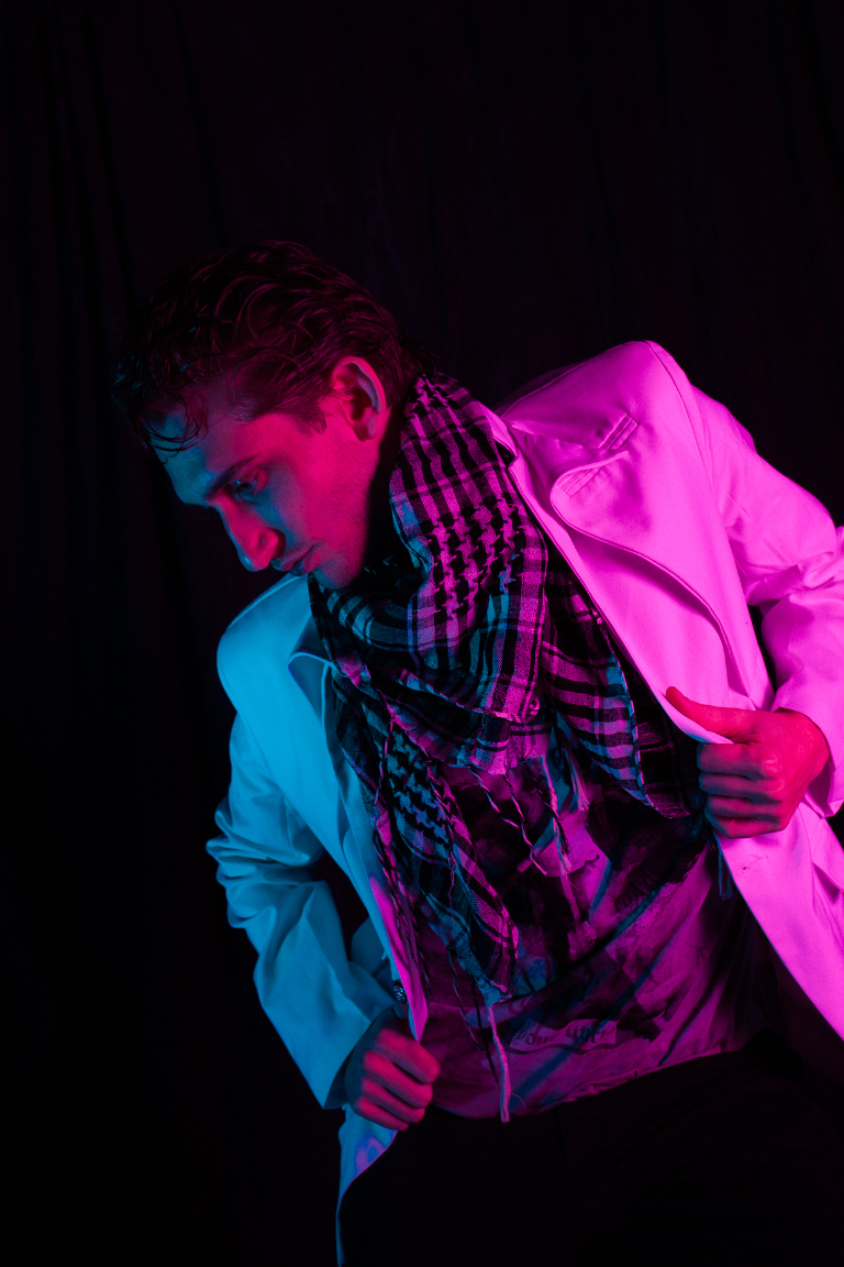 male posing in portrait in pink and blue studio light by New Hope and Lambertville photographer Kasey Ivan