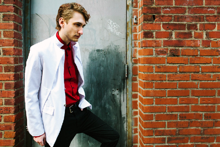 male model posing for fashion editorial in center city Philadelphia by Kasey Ivan Photography