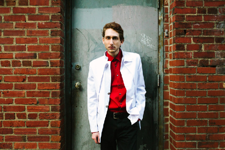 male model posing for fashion editorial in center city Philadelphia by Kasey Ivan Photography