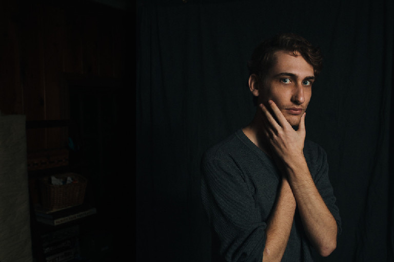 male posing in portrait in dramatic studio light by New Hope and Lambertville photographer Kasey Ivan