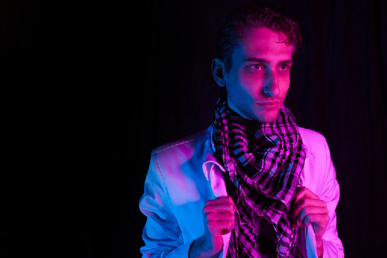 male posing in portrait in dramatic studio light by New Hope and Lambertville photographer Kasey Ivan