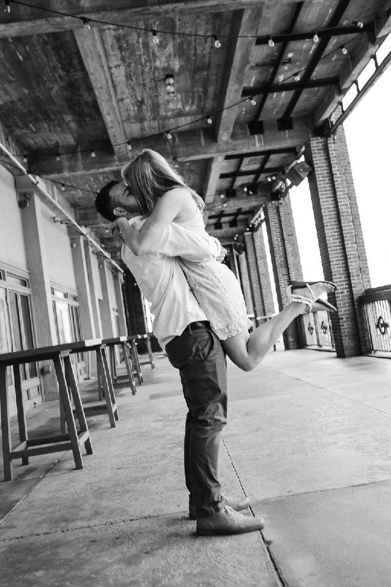 Romantic kiss on the Jersey Shore boardwalk by Asbury Park beach