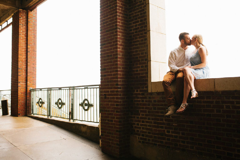 Asbury Park couple kiss for engagement photos on the beach by Kasey Ivan Photography