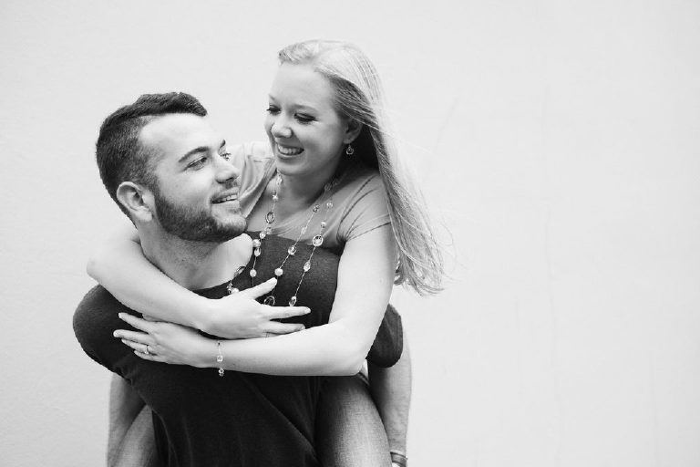 Couple smiling at each other while on piggyback