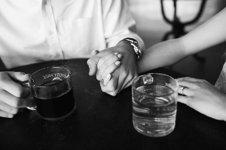 Holding hands at Asbury Park Coffee Shop by Kasey Ivan