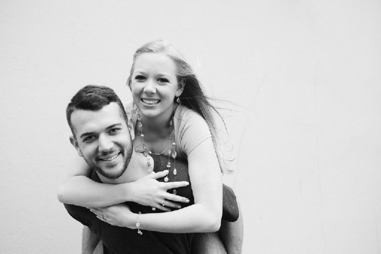 Ryan and Jenna do a piggyback pose for couples photography