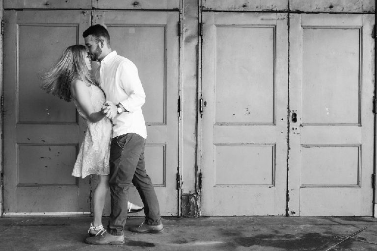 Couple dances closely for engagement photos at the Jersey Shore