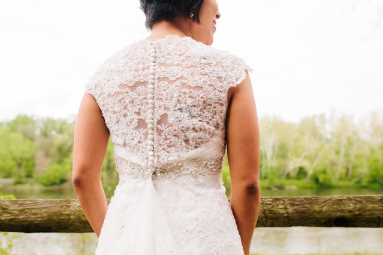 Back of wedding dress detail of Filipina bride overlooking the Delaware River near New Hope PA