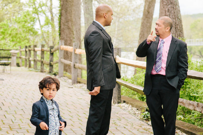 guests speak as a young boy looks on before Filipino Pinoy wedding ceremony at 1740 House