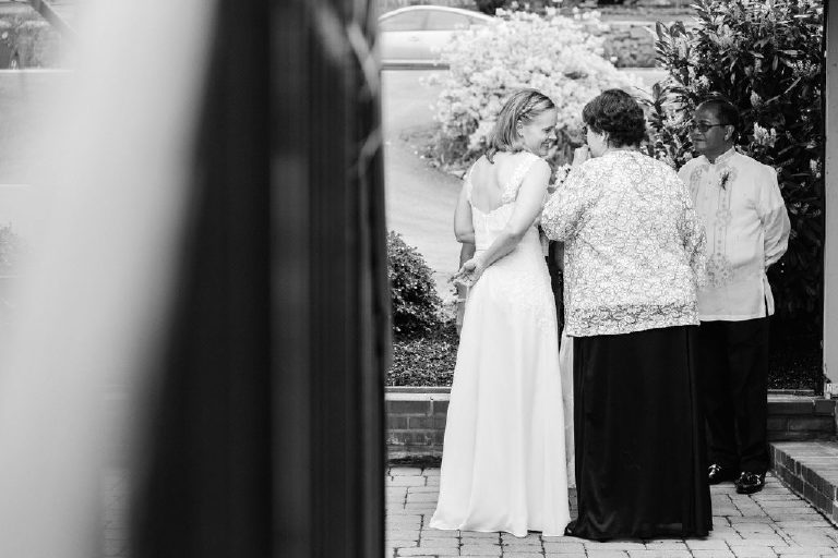 unique artistic perspective of bride and her mother speaking before a wedding at the 1740 House by Kasey Ivan Photography